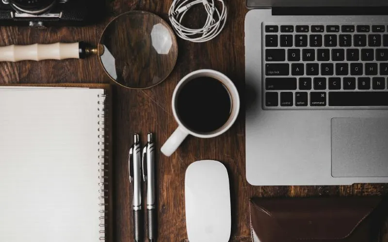 Laptop and coffee on a desk